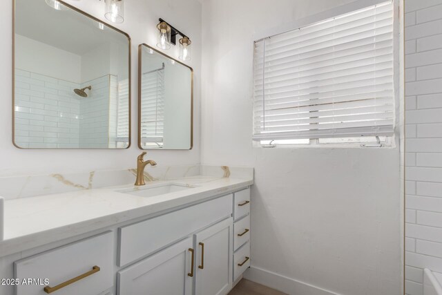 bathroom featuring vanity and walk in shower