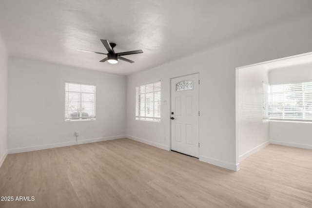 entrance foyer featuring baseboards, light wood-type flooring, and ceiling fan