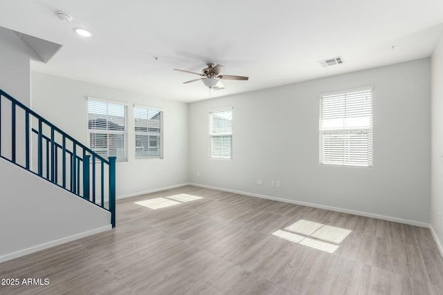 interior space featuring light hardwood / wood-style flooring and ceiling fan