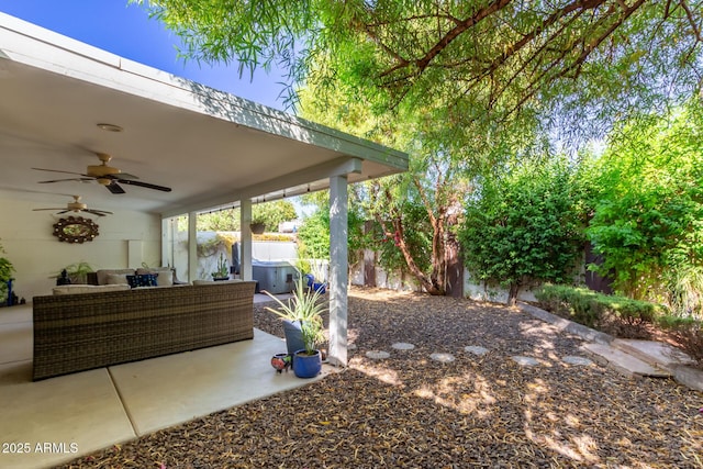 view of yard with outdoor lounge area, ceiling fan, and a patio area