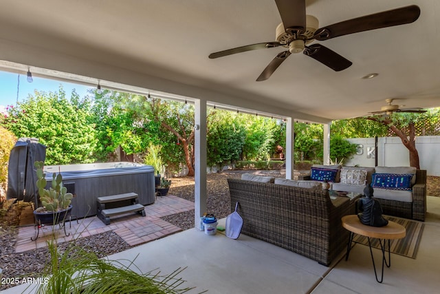 view of patio with a hot tub and outdoor lounge area