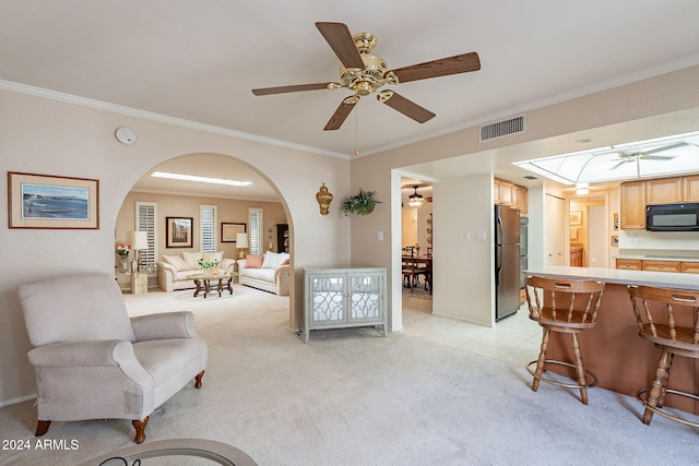 living room with crown molding and light carpet