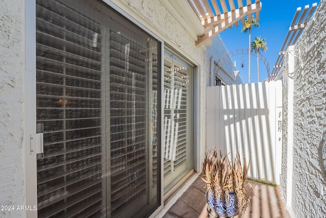 balcony featuring a pergola