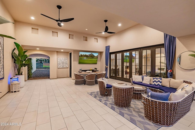 view of patio / terrace featuring an outdoor hangout area, ceiling fan, french doors, and outdoor dining space