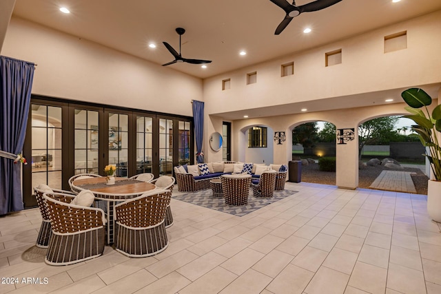 view of patio featuring a ceiling fan, outdoor dining space, and an outdoor hangout area