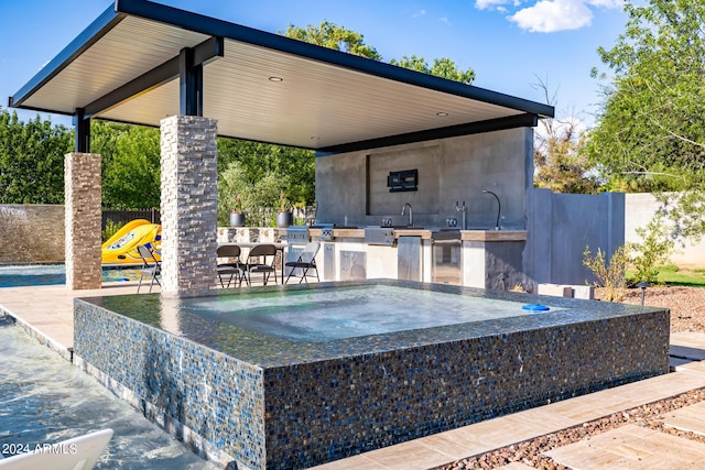 view of patio with fence and area for grilling