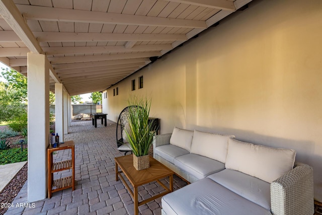 view of patio with outdoor lounge area and fence