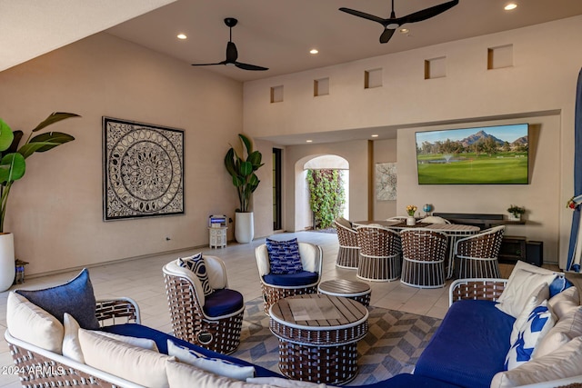 view of patio / terrace with an outdoor hangout area, outdoor dining area, and a ceiling fan