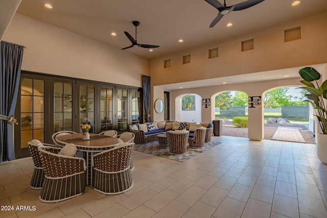 view of patio featuring outdoor dining space, ceiling fan, and an outdoor living space