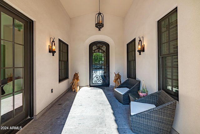 entrance to property with stucco siding