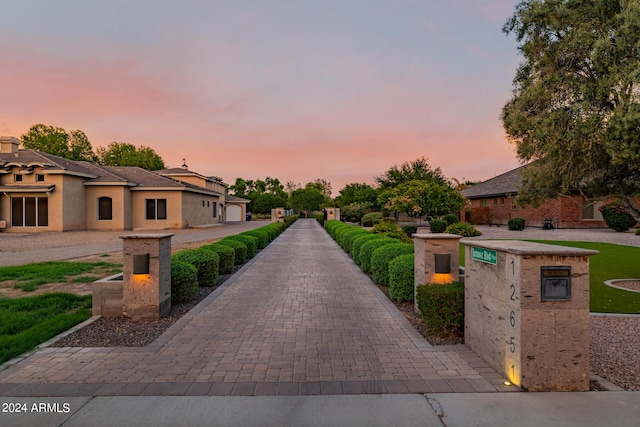 view of property's community with decorative driveway