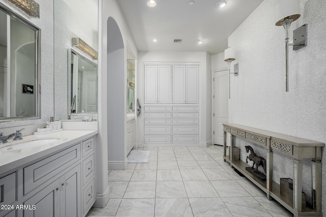 full bath featuring marble finish floor, recessed lighting, visible vents, and vanity