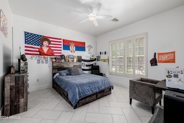 bedroom featuring ceiling fan, visible vents, and baseboards