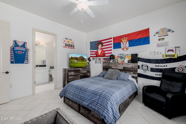 bedroom with ceiling fan, baseboards, and connected bathroom