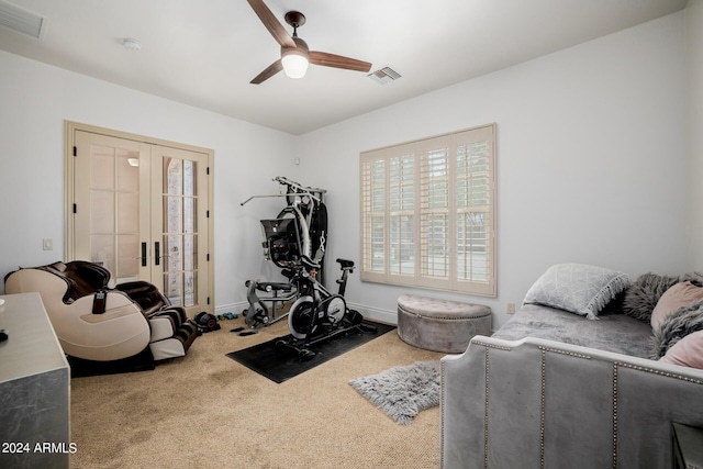 workout room with carpet floors, french doors, visible vents, and baseboards