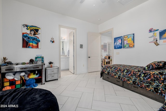 bedroom with ensuite bath, visible vents, ceiling fan, and baseboards