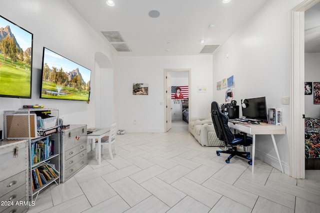 office area featuring baseboards, visible vents, arched walkways, and recessed lighting