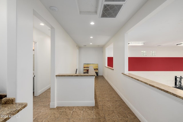 hall featuring recessed lighting, visible vents, and baseboards