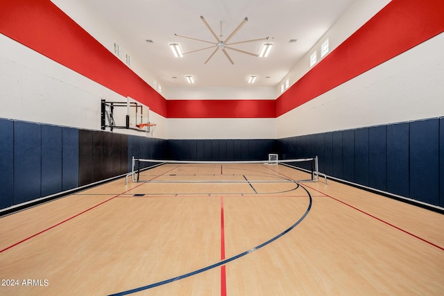 view of basketball court with community basketball court and fence