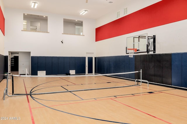 view of basketball court with community basketball court and fence