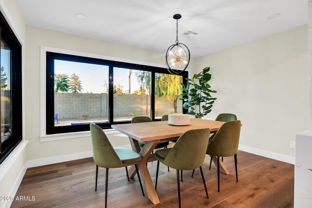4910 E Shaw Butte Dr, Scottsdale, AZ 85254 - dining area with wood finished floors, baseboards, and a chandelier
