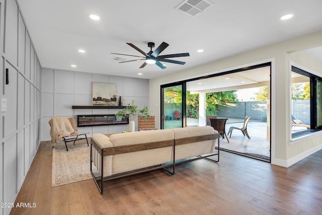 4910 E Shaw Butte Dr, Scottsdale, AZ 85254 - living room featuring light wood-type flooring, a ceiling fan, recessed lighting, and baseboards