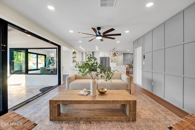 4910 E Shaw Butte Dr, Scottsdale, AZ 85254 - living area featuring ceiling fan, recessed lighting, and light wood-type flooring
