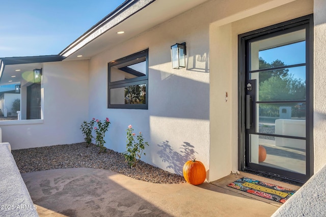 4910 E Shaw Butte Dr, Scottsdale, AZ 85254 - view of exterior entry featuring stucco siding and a patio