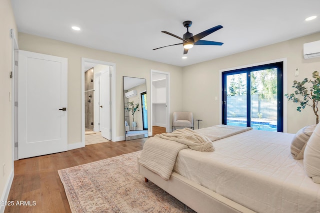 4910 E Shaw Butte Dr, Scottsdale, AZ 85254 - bedroom featuring access to exterior, wood finished floors, baseboards, a wall mounted AC, and recessed lighting