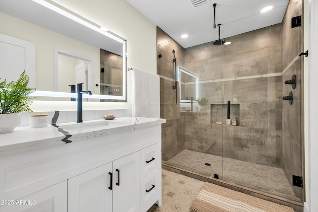 4910 E Shaw Butte Dr, Scottsdale, AZ 85254 - bathroom with a shower stall, vanity, and recessed lighting