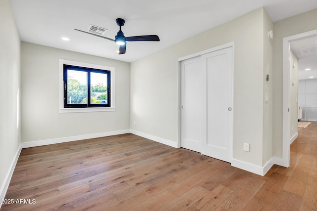 4910 E Shaw Butte Dr, Scottsdale, AZ 85254 - unfurnished bedroom with hardwood / wood-style floors, baseboards, a closet, recessed lighting, and a ceiling fan