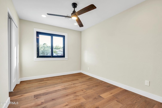 4910 E Shaw Butte Dr, Scottsdale, AZ 85254 - unfurnished bedroom with light wood-type flooring, a closet, baseboards, recessed lighting, and a ceiling fan