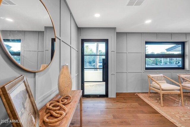 4910 E Shaw Butte Dr, Scottsdale, AZ 85254 - entrance foyer with light wood finished floors, recessed lighting, and a decorative wall