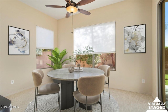 dining space with ceiling fan