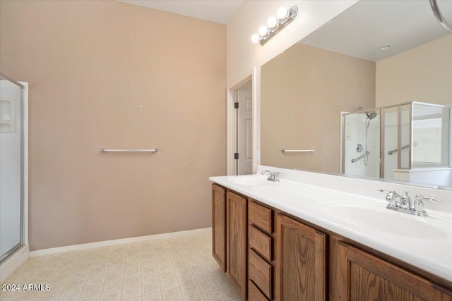 bathroom featuring vanity and an enclosed shower