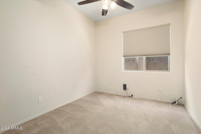 carpeted empty room with ceiling fan