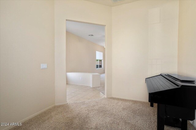 interior space featuring light colored carpet