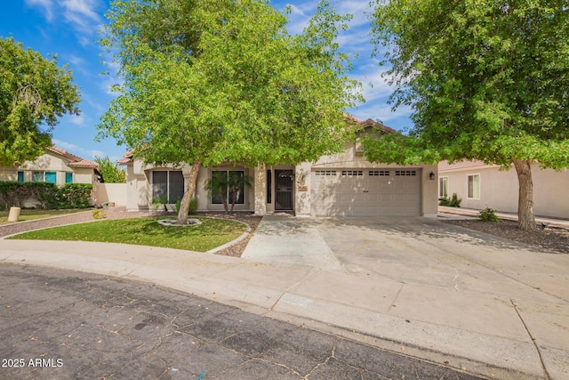 obstructed view of property with a garage, a front lawn, stucco siding, and driveway