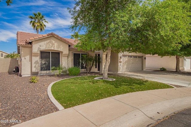 mediterranean / spanish home with a front lawn, a tile roof, a garage, stucco siding, and concrete driveway