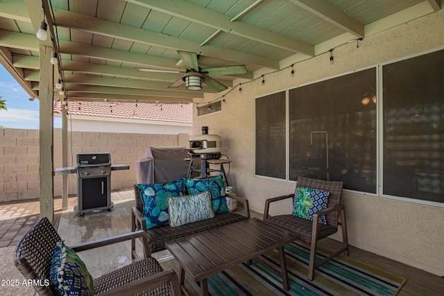 view of patio / terrace with a ceiling fan, fence, and area for grilling
