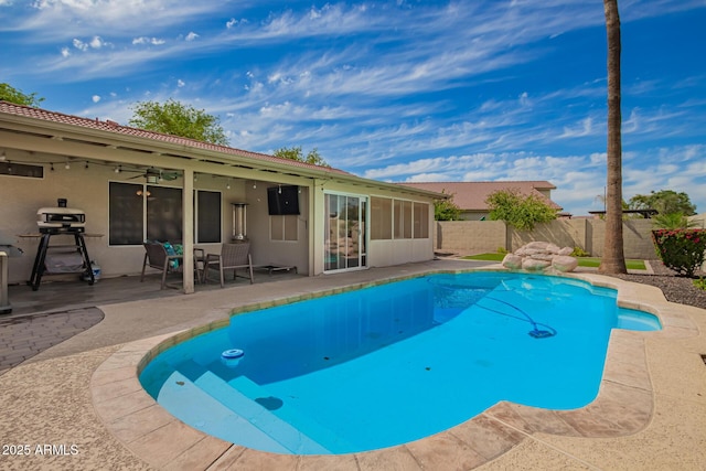 view of pool featuring ceiling fan, a fenced in pool, a fenced backyard, and a patio area