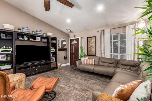 living area with baseboards, ceiling fan, wood finished floors, and lofted ceiling