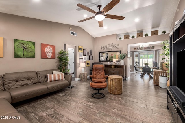 living room featuring high vaulted ceiling, ceiling fan, wood finished floors, and visible vents