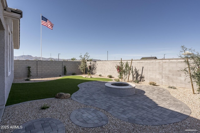 view of yard with a fire pit and a patio area