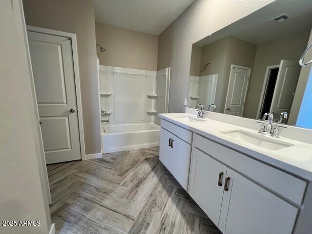 17066 W Seldon Ln, Waddell, AZ 85355 - full bath with double vanity and washtub / shower combination