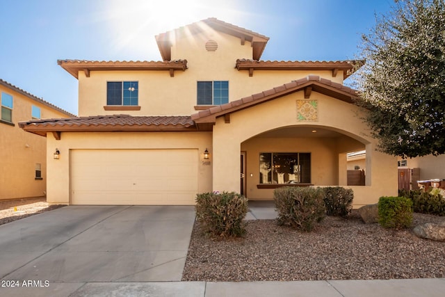 mediterranean / spanish-style home featuring a garage