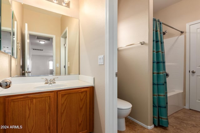 full bathroom featuring vanity, shower / bathtub combination with curtain, and toilet