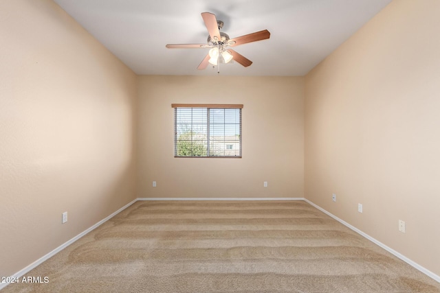 empty room with light carpet and ceiling fan