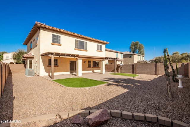 back of house featuring cooling unit and a patio