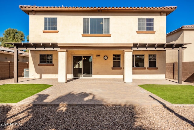 back of house featuring a pergola and a patio area